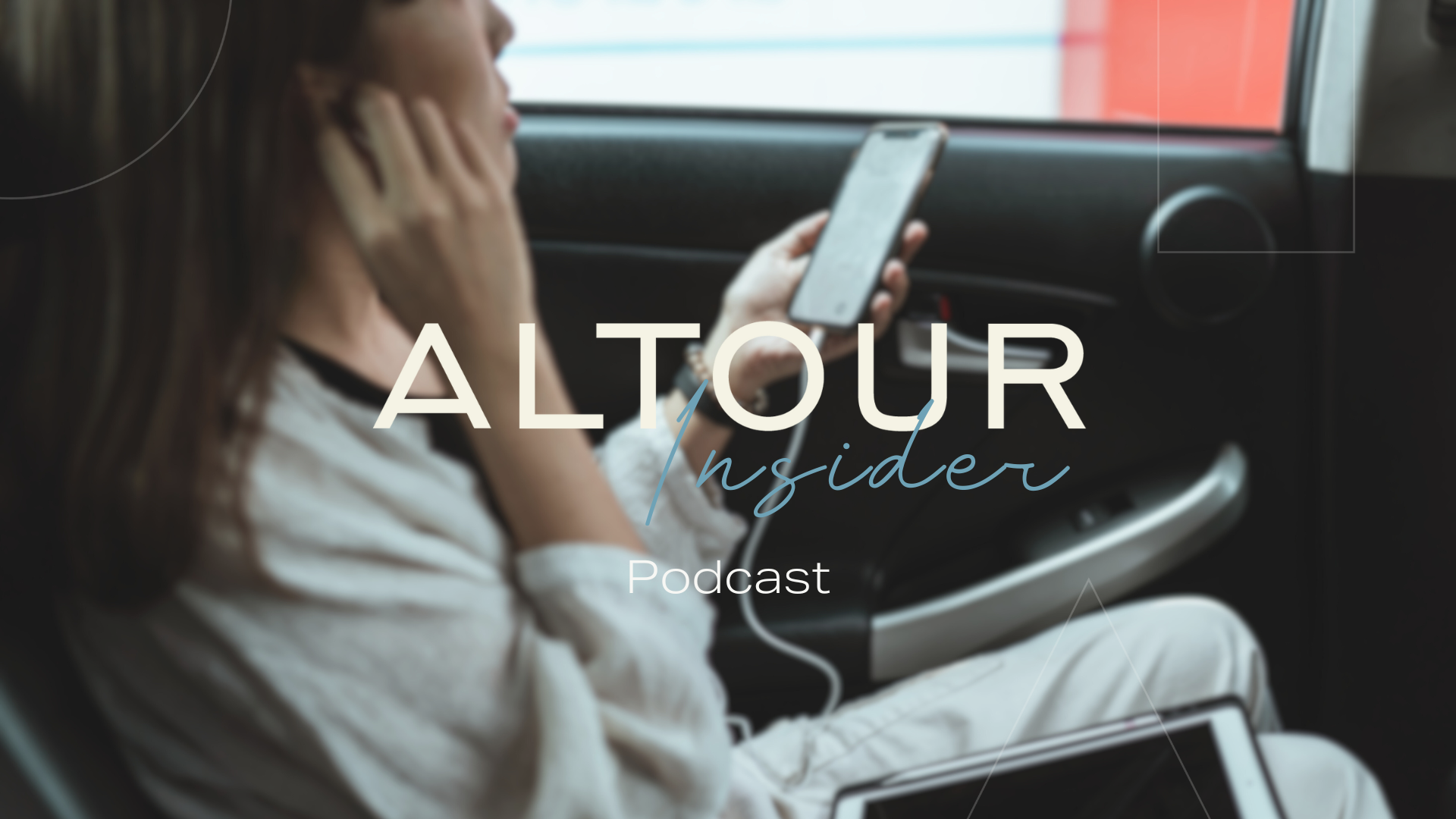A woman in the back of a car, putting an earphone into her right ear whilst looking at her phone screen.